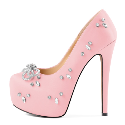 Side angle showing the high 15cm heel, rhinestone bow, and satin texture