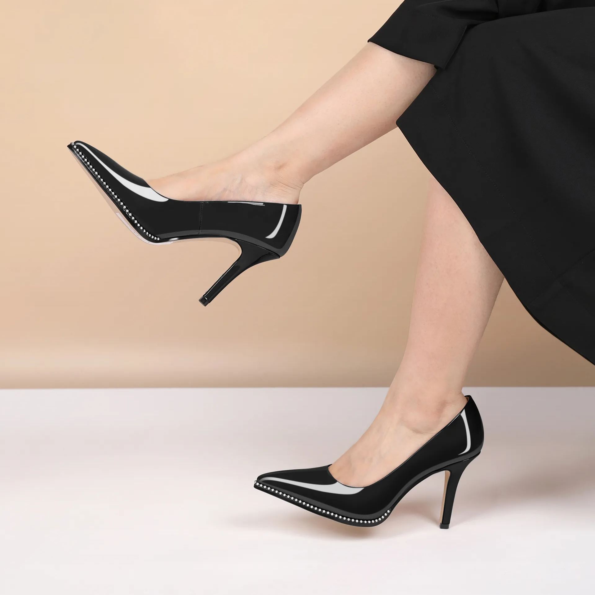 Model wearing wine red beaded stilettos with evening dress