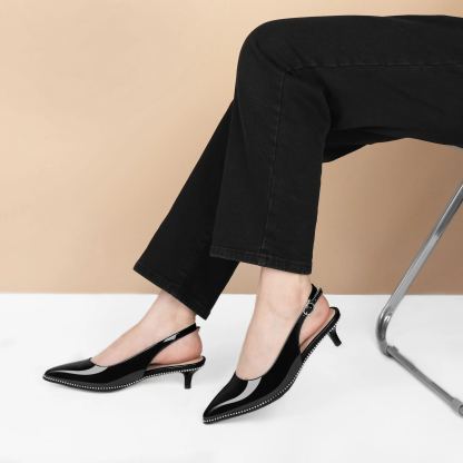 Beige beaded kitten pumps styled with tailored trousers for office chic