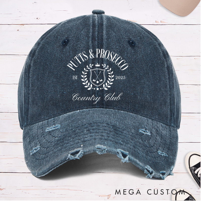 Personalized Distressed Denim Baseball Cap with "Putts & Prosecco" Country Club Laurel Crest Design and Custom EST Year