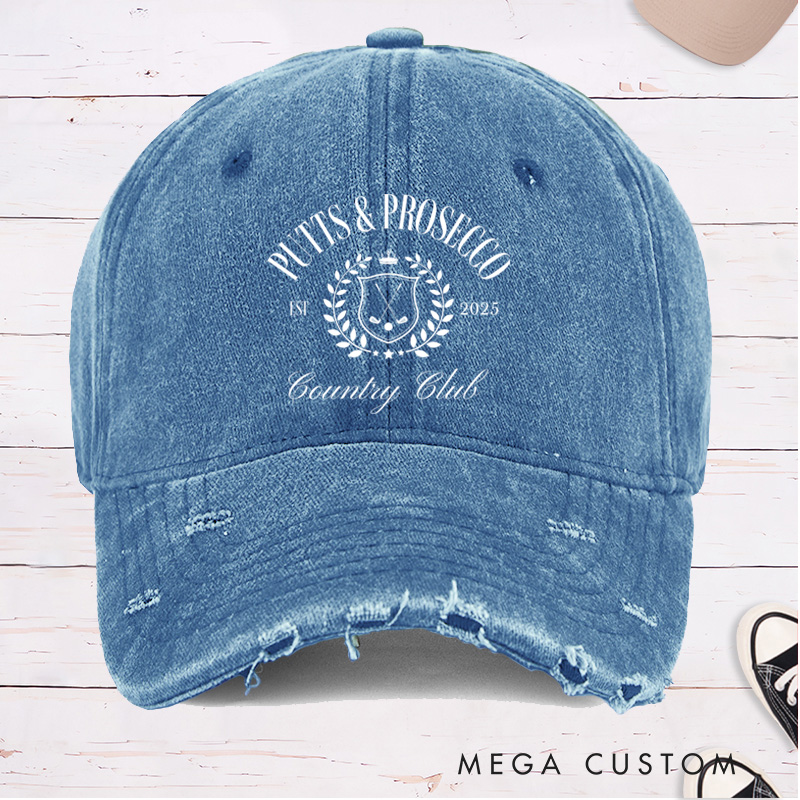 Personalized Distressed Denim Baseball Cap with "Putts & Prosecco" Country Club Laurel Crest Design and Custom EST Year