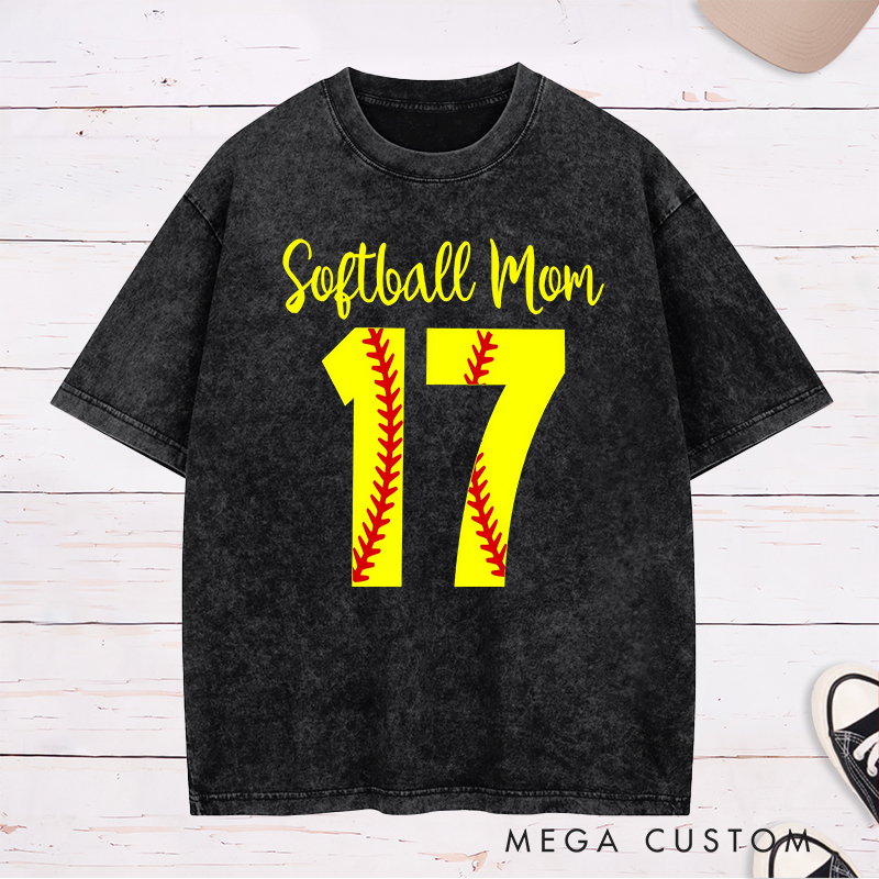 Personalized Softball Mom Washed T-Shirt Design Featuring Customizable Player Number with Red Stitch Softball Pattern and Stylish Yellow Script Text