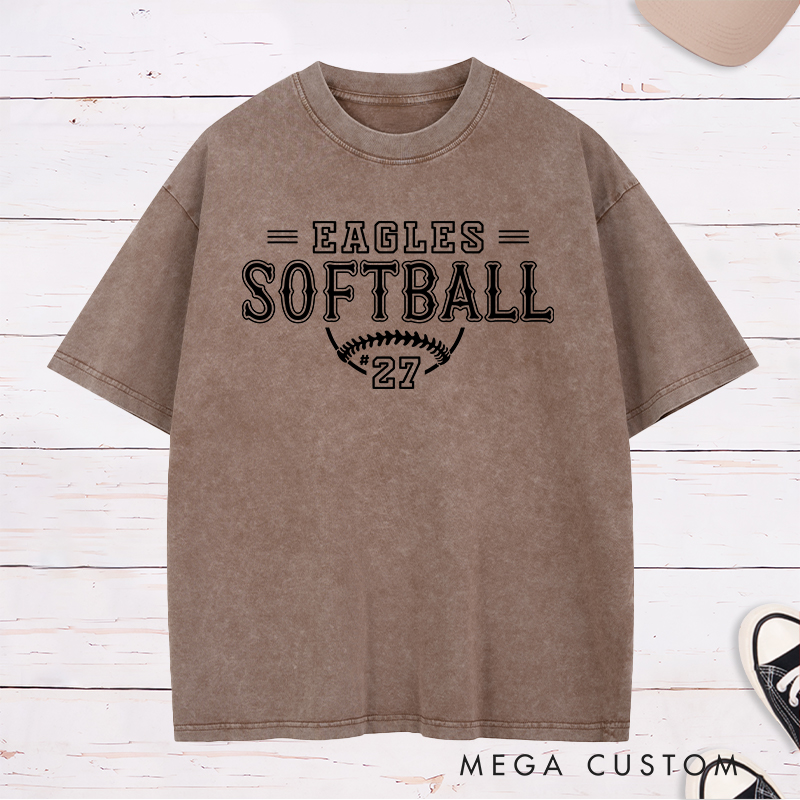 Personalized Softball Washed T-Shirt Featuring a Customizable Team Name Player Number Vintage-Inspired Typography and a Softball Stitch Graphic
