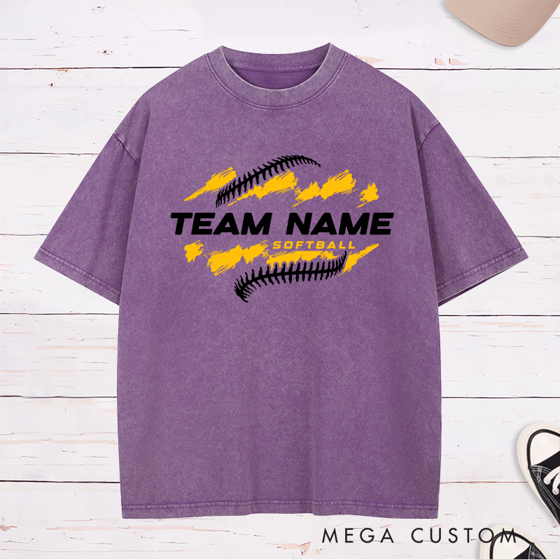 Personalized Softball Team Washed T-Shirt Design Featuring Customizable Team Name Bold Text Dynamic Brushstroke Elements and Softball Stitch Graphics