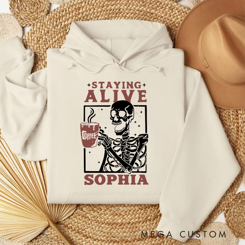 Personalized Skeleton Drinking Coffee Staying Alive Halloween Vibes Hoodies