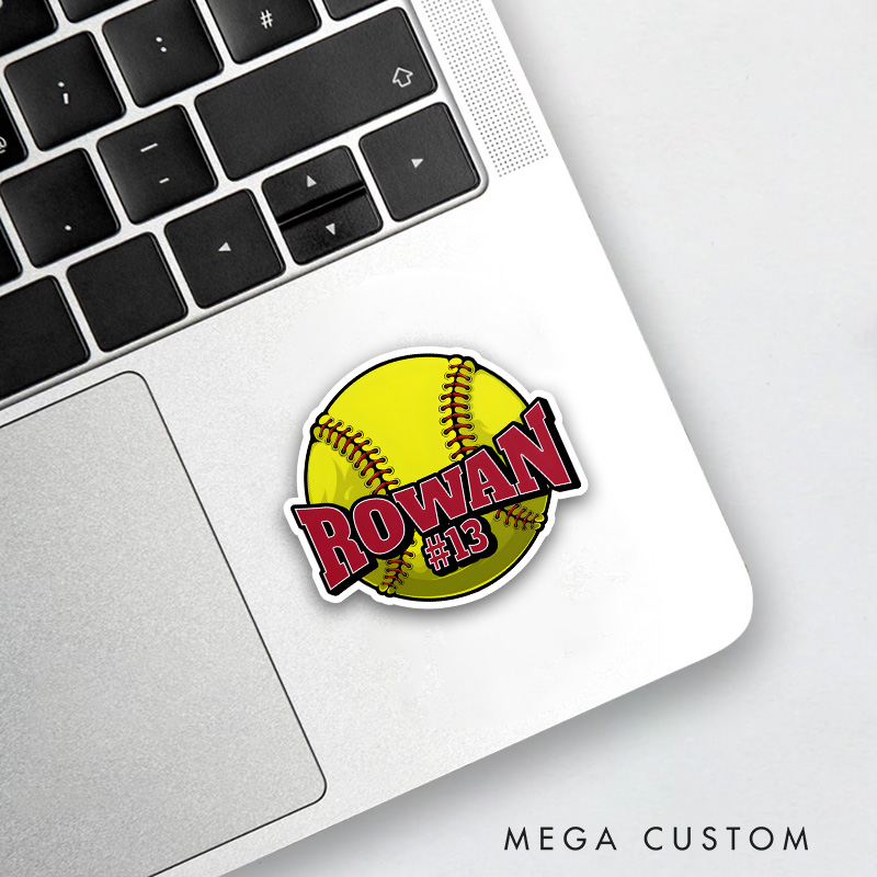 Personalized Softball Decal with Custom Name and Number on a Vibrant Yellow Softball Design Featuring Bold Red Lettering Black Outline and Realistic Stitching