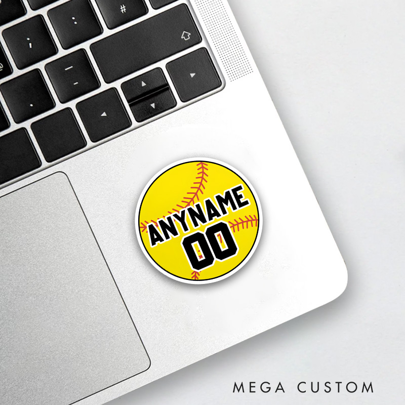 Personalized Softball Decal with Custom Name and Number on a Vibrant Yellow Softball Design Featuring Bold Black and White Block Lettering Realistic Red Stitching and a Clean Circular Layout