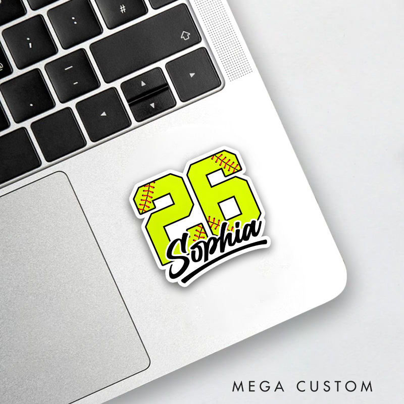 Personalized Softball Decal Featuring a Bold Custom Number in Vibrant Yellow with Realistic Red Softball Stitching Accented by a Custom Name in Elegant Black Script Lettering and a Dynamic Underline