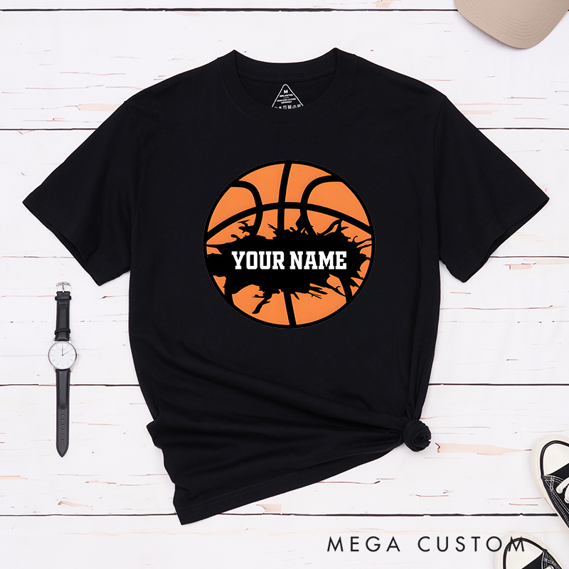 Personalized Basketball T-Shirt Design Featuring Bold Orange Basketball Graphic with Splatter Effect and Customizable Name