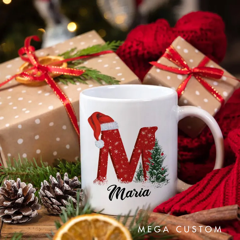 Personalized Christmas Initial Mug with Santa Hat and Tree Design for a Festive and Custom Holiday Gift Mug