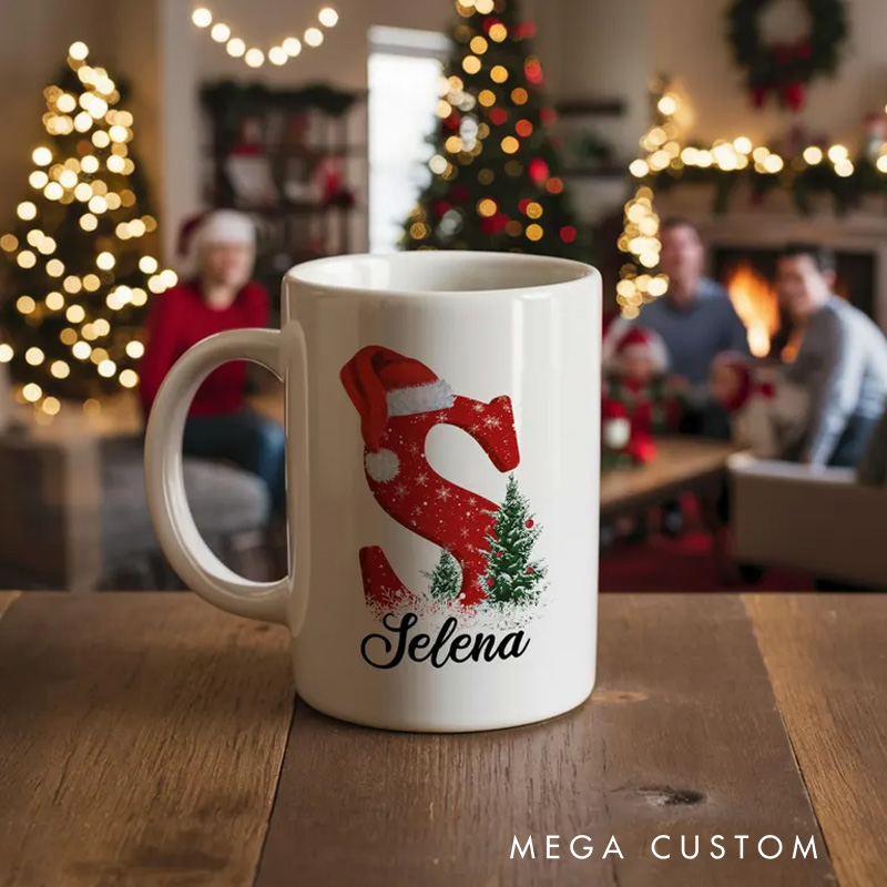 Personalized Christmas Initial Mug with Santa Hat and Tree Design for a Festive and Custom Holiday Gift Mug