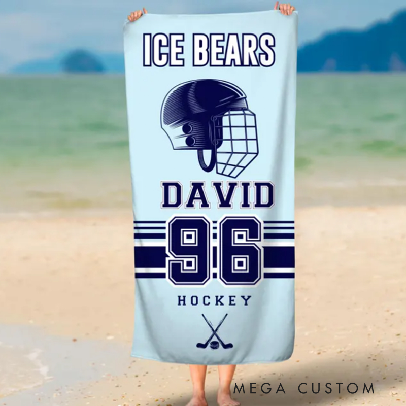 Personalized Hockey Beach Towel with Custom Team Name Player Name Number and Light Blue Design Featuring Helmet and Crossed Sticks