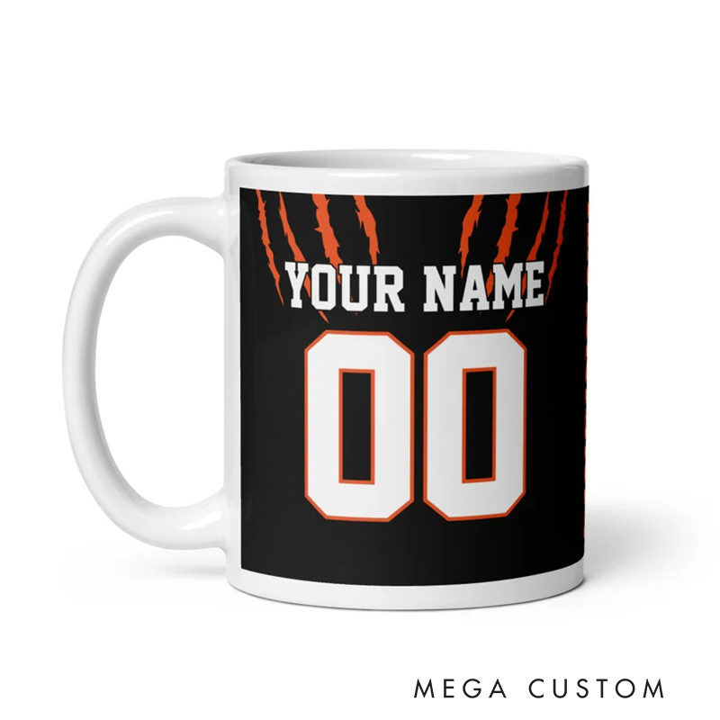 Personalized Football Mug with Customizable Team Name Player Name and Jersey Number in Bold Black and Orange Claw Design