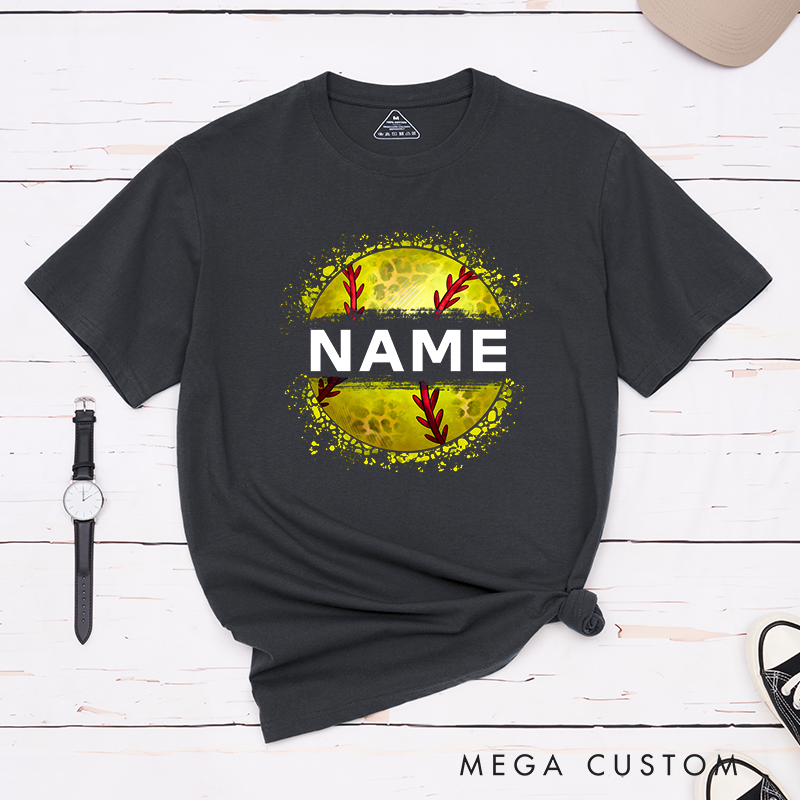 Personalized Softball T-Shirt Design Featuring Custom Name Displayed Boldly Across a Distressed Softball Graphic with Textured Details