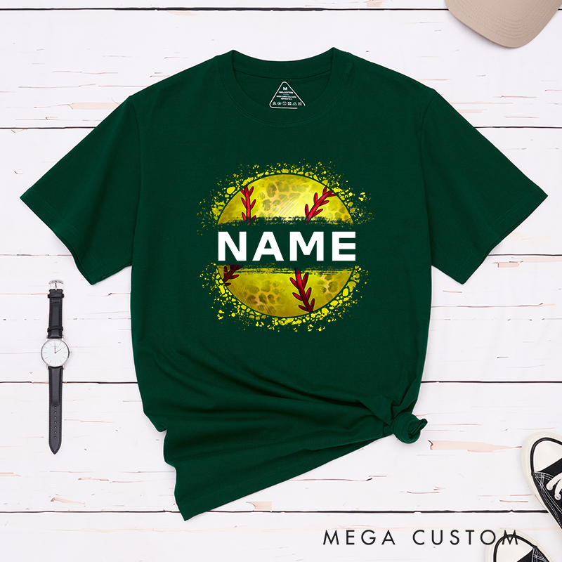 Personalized Softball T-Shirt Design Featuring Custom Name Displayed Boldly Across a Distressed Softball Graphic with Textured Details