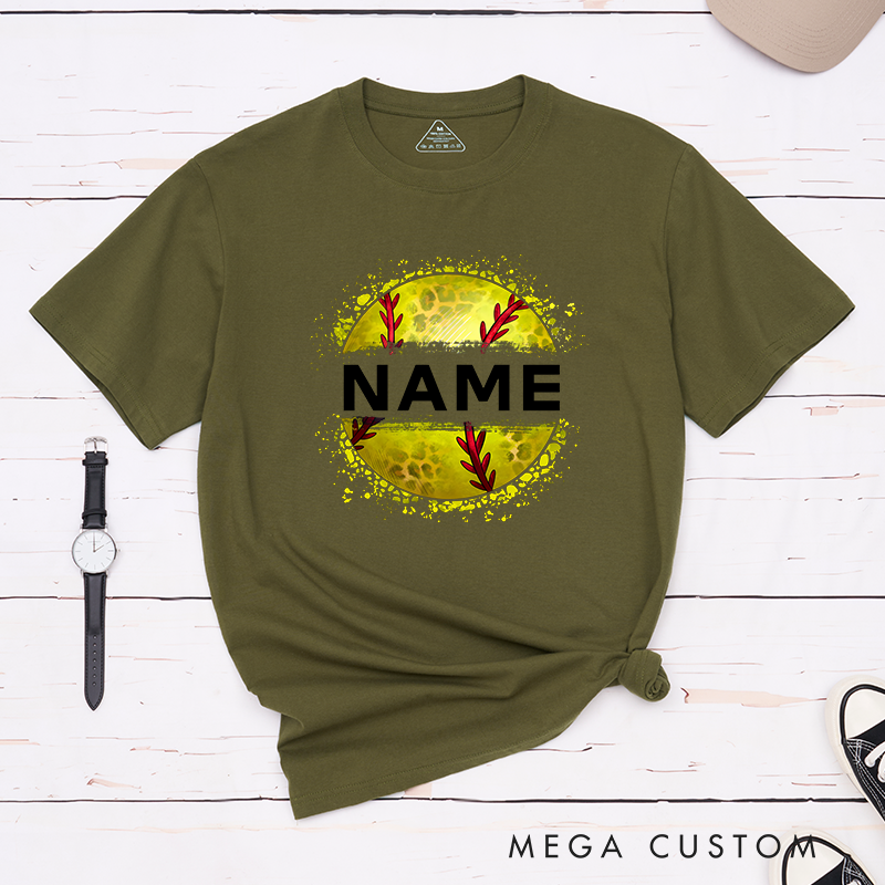 Personalized Softball T-Shirt Design Featuring Custom Name Displayed Boldly Across a Distressed Softball Graphic with Textured Details