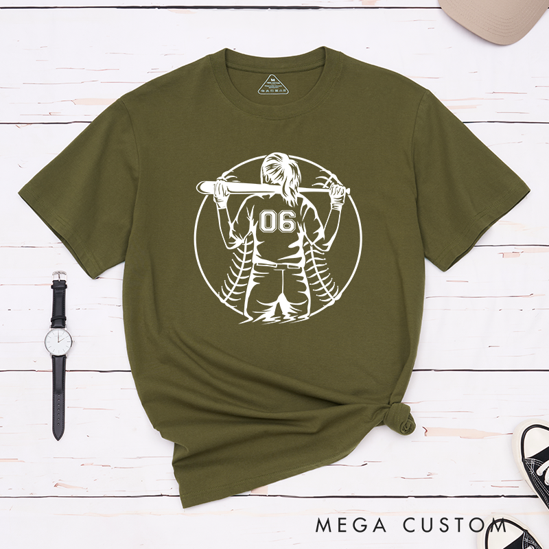 Personalized Softball Player T-Shirt Design Featuring a Back View of a Batter Holding a Bat Customizable Jersey Number and Bold Softball Stitching Graphic in the Background