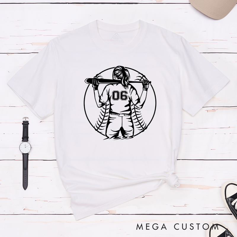 Personalized Softball Player T-Shirt Design Featuring a Back View of a Batter Holding a Bat Customizable Jersey Number and Bold Softball Stitching Graphic in the Background