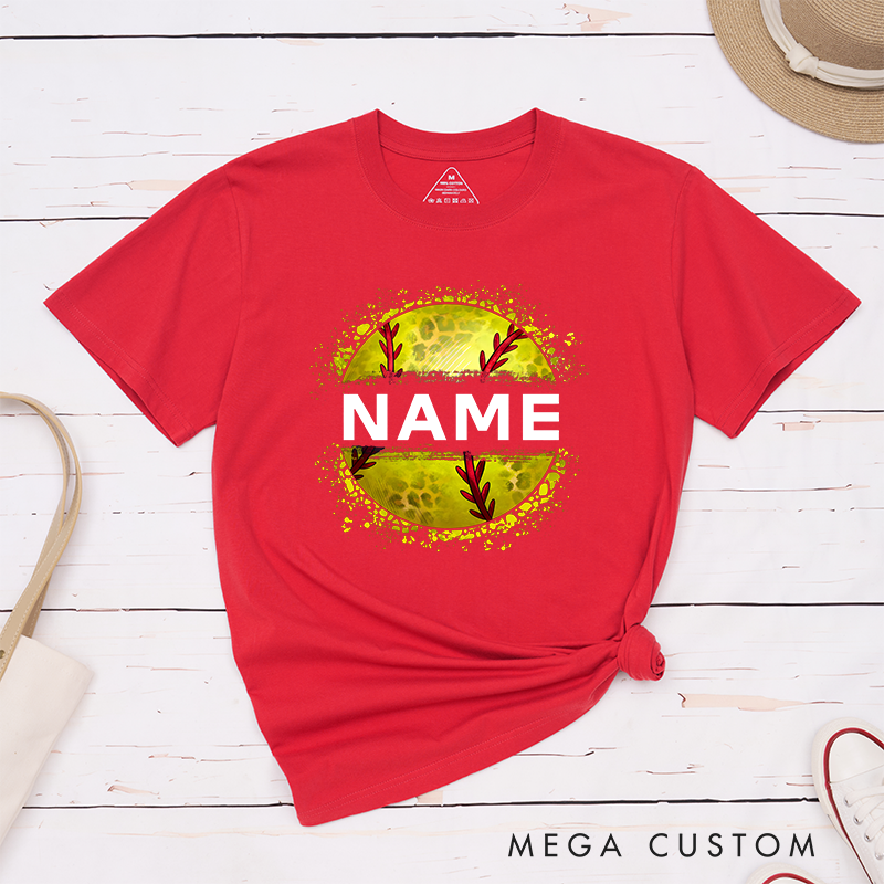 Personalized Softball T-Shirt Design Featuring Custom Name Displayed Boldly Across a Distressed Softball Graphic with Textured Details