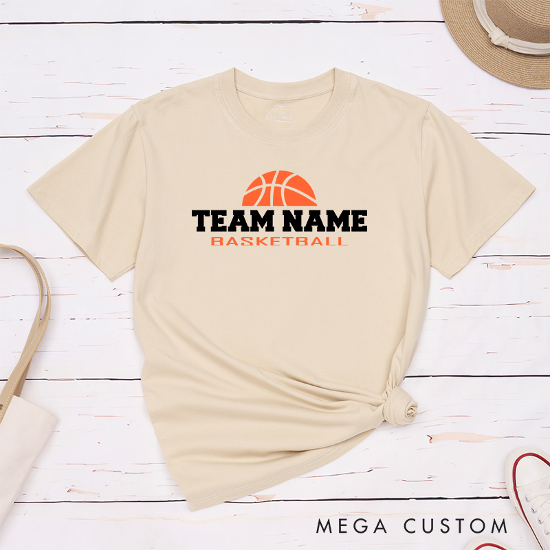 Personalized Basketball Team T-Shirt Design Showcasing Bold Team Name Text and a Striking Orange Basketball Graphic for a Sporty and Dynamic Look