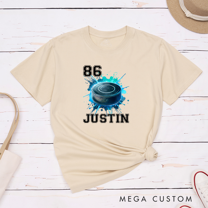 Personalized Athletic T-Shirt Featuring a Vibrant Hockey Puck Graphic and Custom Name