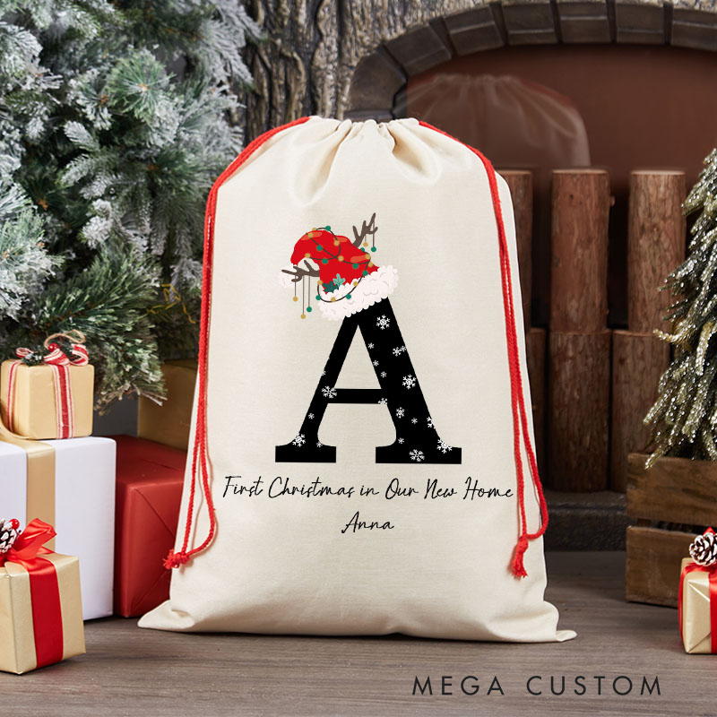 Personalized First Christmas in Our New Home Gift Bag Custom Christmas Sack with Name Initial Santa Hat Design Holiday Decoration New Home Keepsake