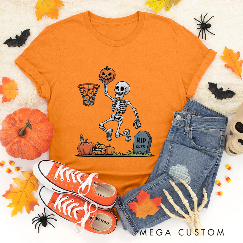Personalized Halloween Basketball T-Shirt with Skeleton Dunking a Pumpkin Design and Customizable Year