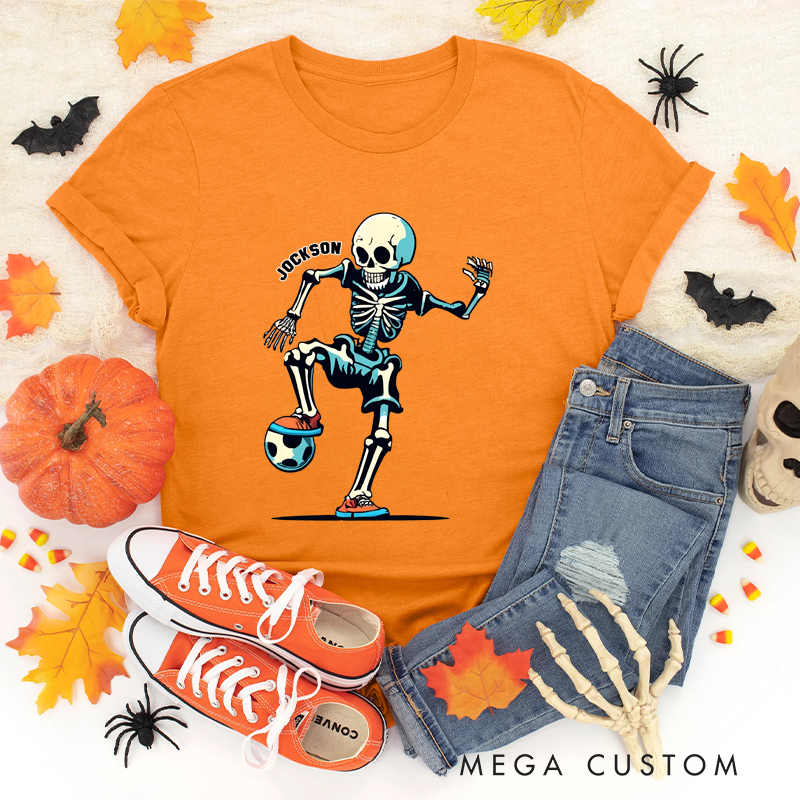 Personalized Halloween Soccer T-Shirt with Skeleton Kicking a Ball and Custom Name Design