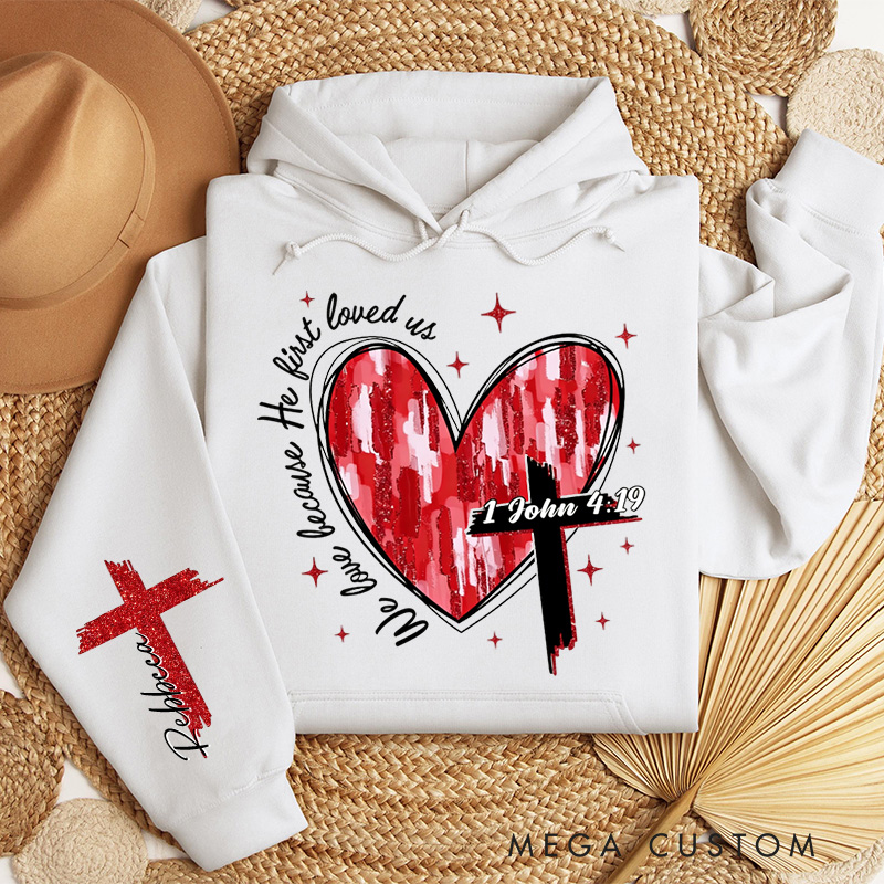 Personalized We Love Because He First Loved Us Classic Hoodies with Custom Name Heart Cross Valentine Bible Verse Hoodie Love Jesus Valentine Day Gift
