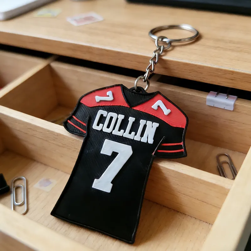 Personalized Football Jersey Keychains Featuring Custom Names and Numbers Design