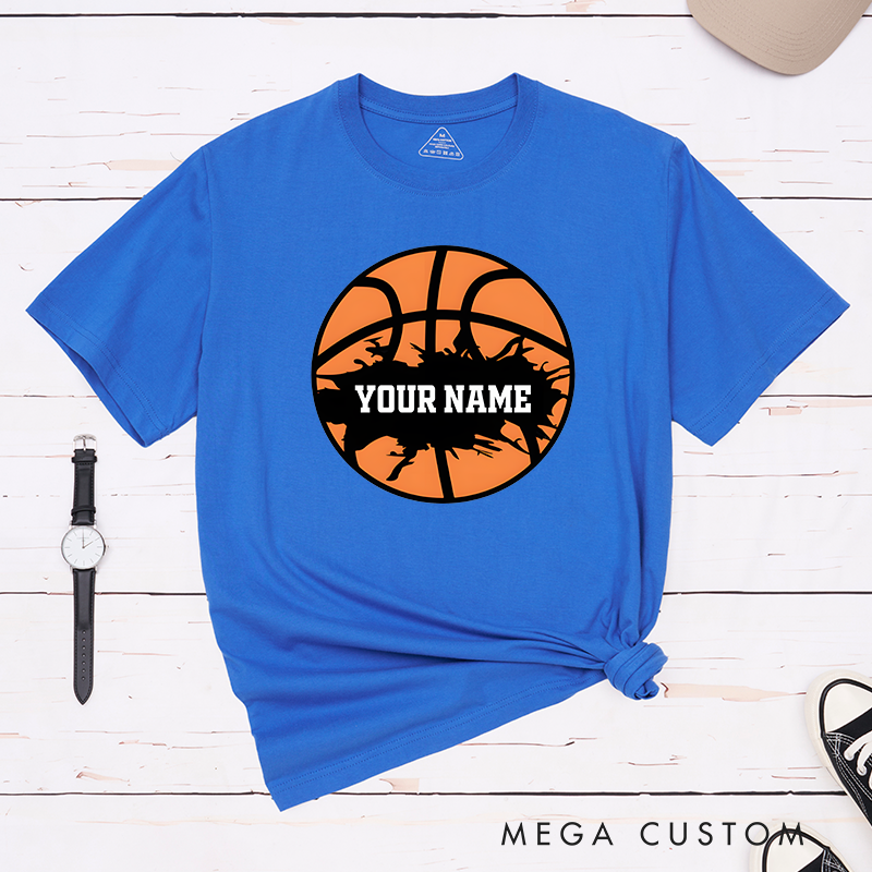 Personalized Basketball T-Shirt Design Featuring Bold Orange Basketball Graphic with Splatter Effect and Customizable Name