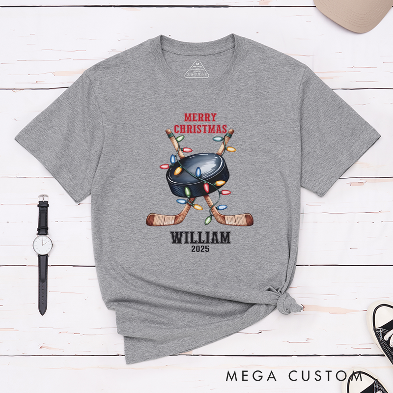 Personalized Christmas Hockey T-Shirt with Custom Name, Year, and Festive Holiday Lights Design