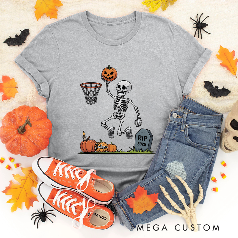 Personalized Halloween Basketball T-Shirt with Skeleton Dunking a Pumpkin Design and Customizable Year