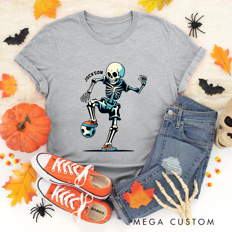 Personalized Halloween Soccer T-Shirt with Skeleton Kicking a Ball and Custom Name Design
