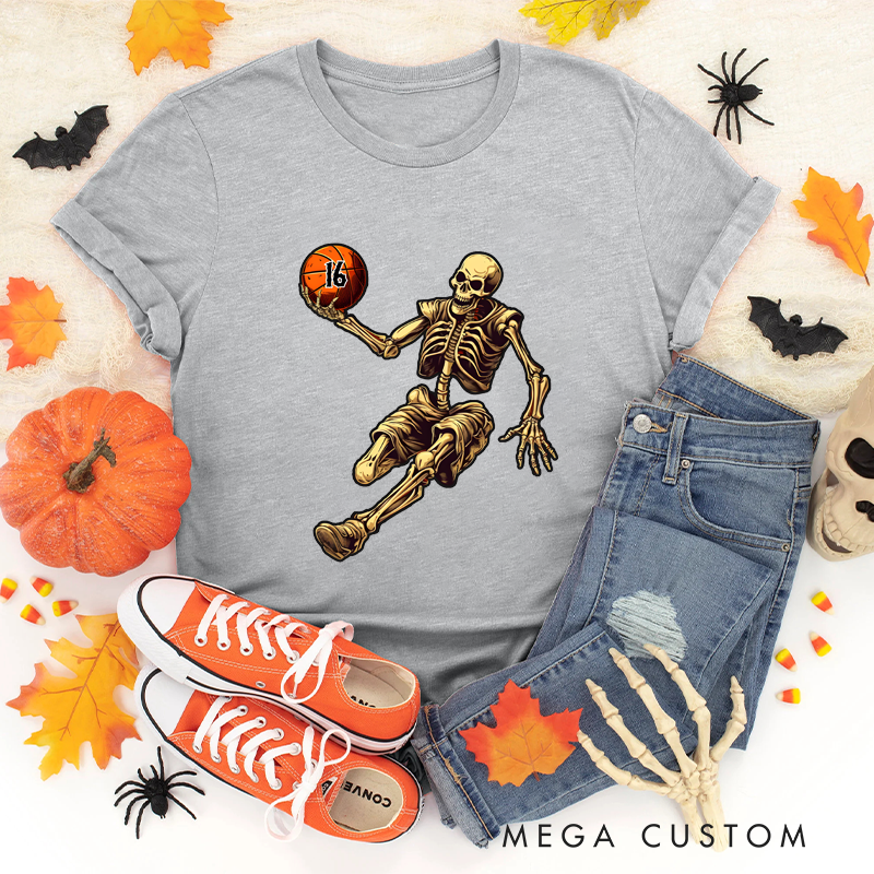 Personalized Halloween Basketball T-Shirt with Skeleton Dribbling Pumpkin Ball and Customizable Number Design