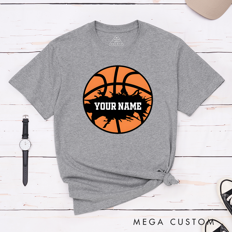 Personalized Basketball T-Shirt Design Featuring Bold Orange Basketball Graphic with Splatter Effect and Customizable Name
