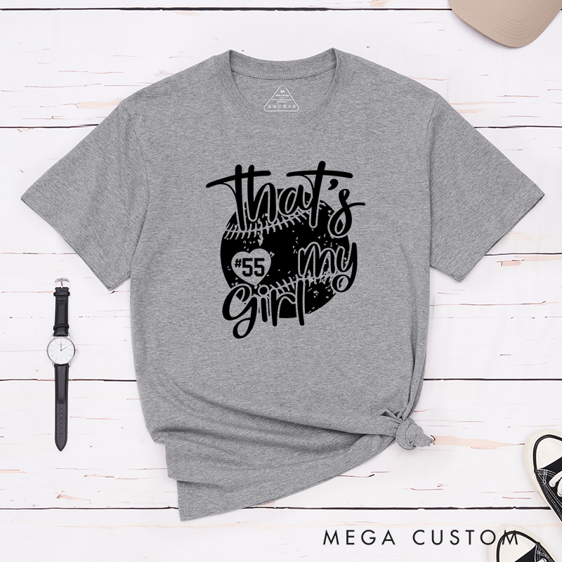 Personalized Softball T-Shirt Design Featuring Customizable Player Number Heart-Shaped Accent Playful Handwritten Script Font and Distressed Softball Graphic for a Stylish and Sentimental Look