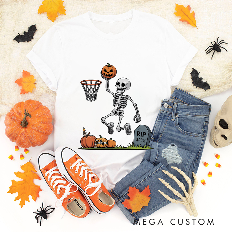 Personalized Halloween Basketball T-Shirt with Skeleton Dunking a Pumpkin Design and Customizable Year