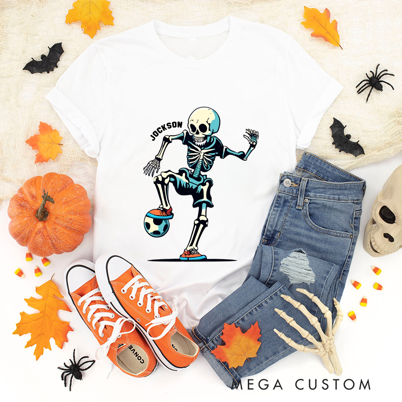 Personalized Halloween Soccer T-Shirt with Skeleton Kicking a Ball and Custom Name Design
