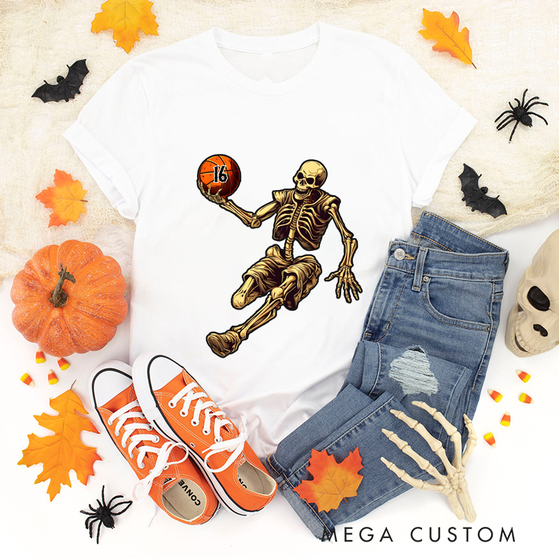 Personalized Halloween Basketball T-Shirt with Skeleton Dribbling Pumpkin Ball and Customizable Number Design