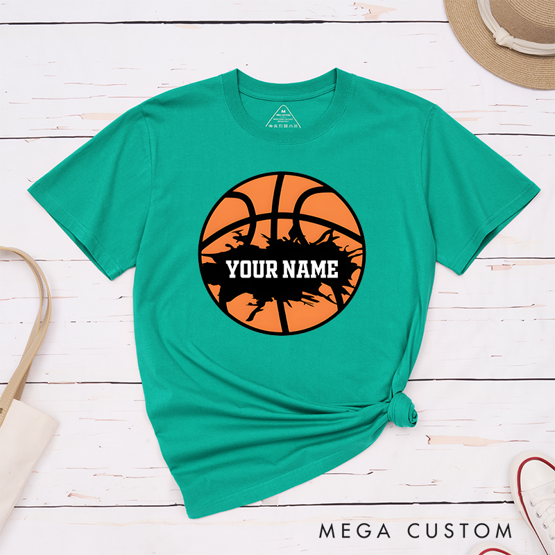 Personalized Basketball T-Shirt Design Featuring Bold Orange Basketball Graphic with Splatter Effect and Customizable Name