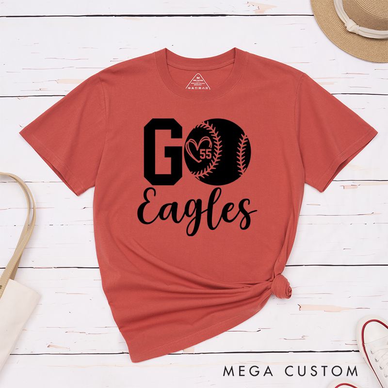 Personalized Softball Spirit T-Shirt Design Featuring Bold "Go" Text Team Name in Elegant Script Heart-Shaped Player Number Inside a Softball Graphic Perfect for Fans and Players