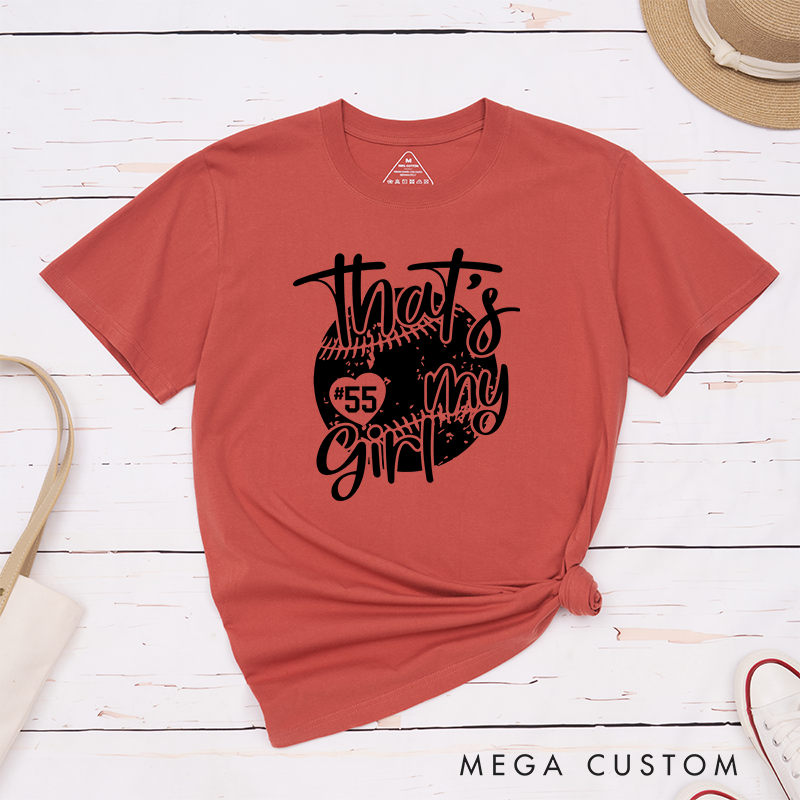 Personalized Softball T-Shirt Design Featuring Customizable Player Number Heart-Shaped Accent Playful Handwritten Script Font and Distressed Softball Graphic for a Stylish and Sentimental Look