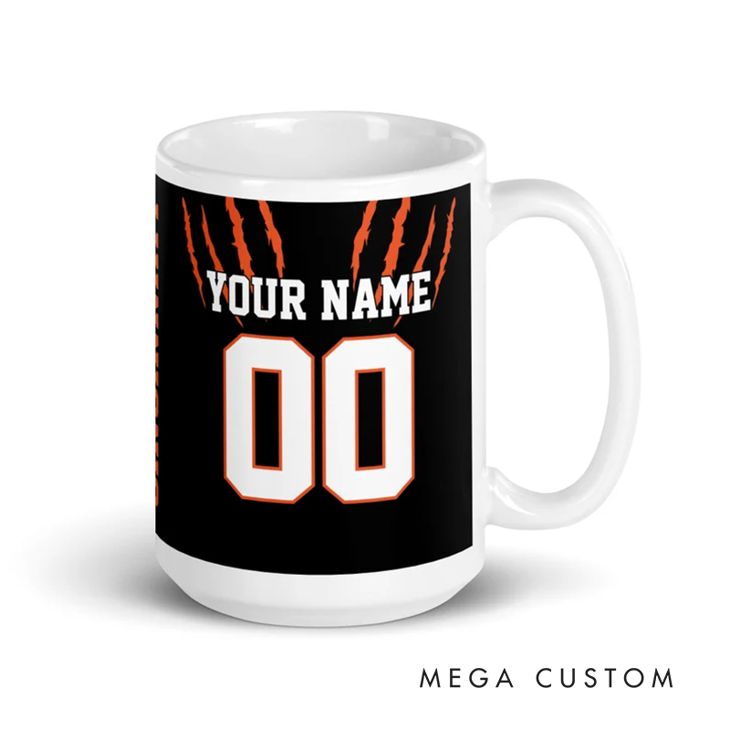Personalized Football Mug with Customizable Team Name Player Name and Jersey Number in Bold Black and Orange Claw Design
