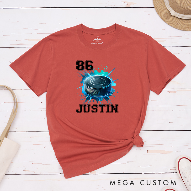 Personalized Athletic T-Shirt Featuring a Vibrant Hockey Puck Graphic and Custom Name