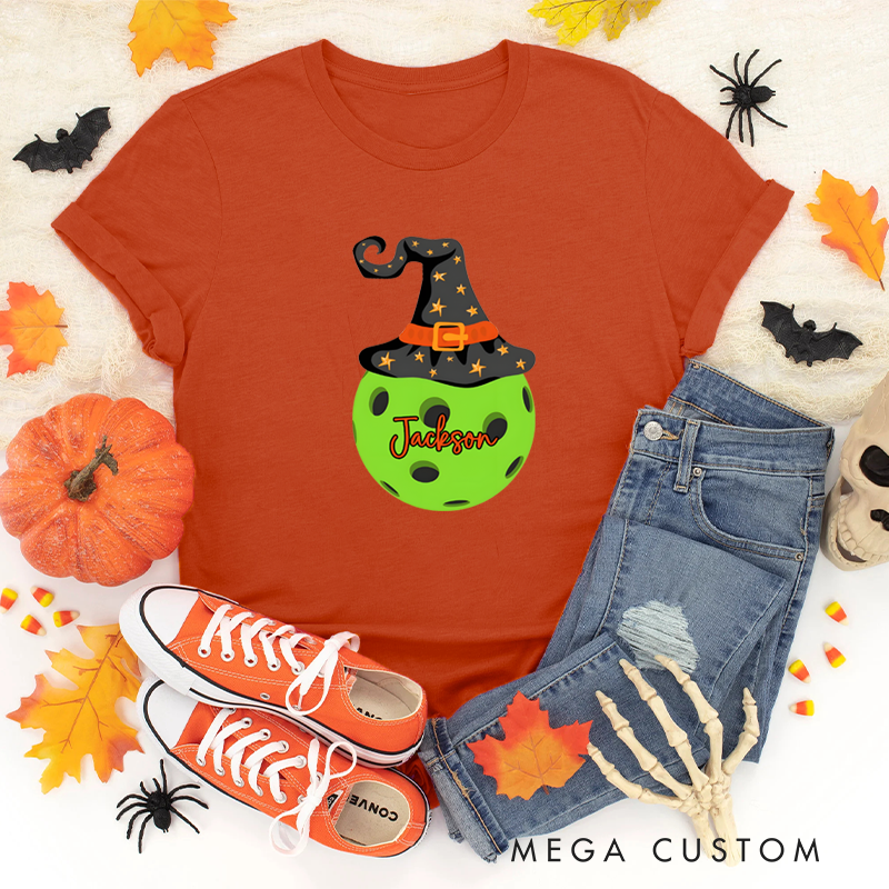 Personalized Halloween Pickleball T-Shirt with Witch Hat and Custom Name on Spooky Ball Design