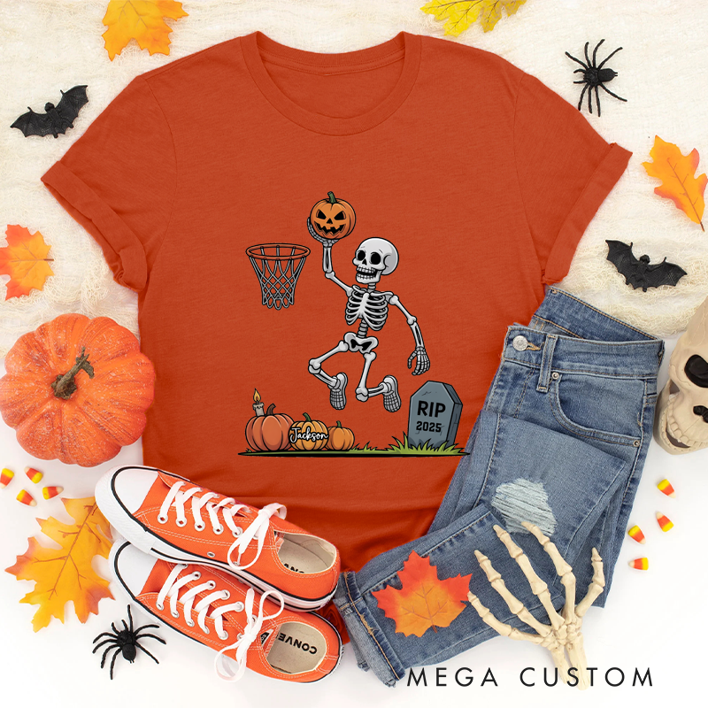 Personalized Halloween Basketball T-Shirt with Skeleton Dunking a Pumpkin Design and Customizable Year