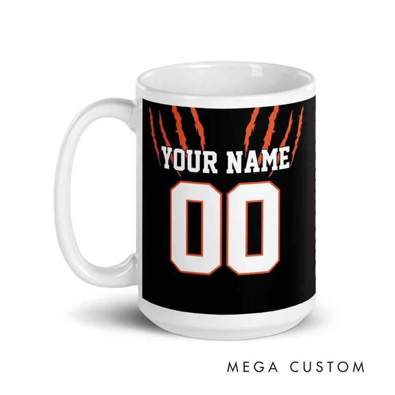 Personalized Football Mug with Customizable Team Name Player Name and Jersey Number in Bold Black and Orange Claw Design