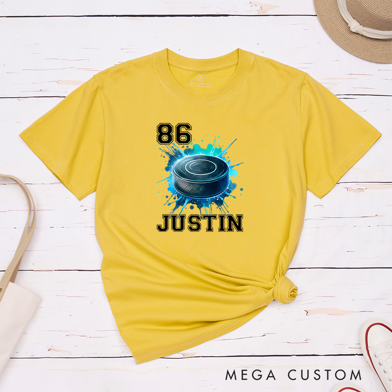 Personalized Athletic T-Shirt Featuring a Vibrant Hockey Puck Graphic and Custom Name