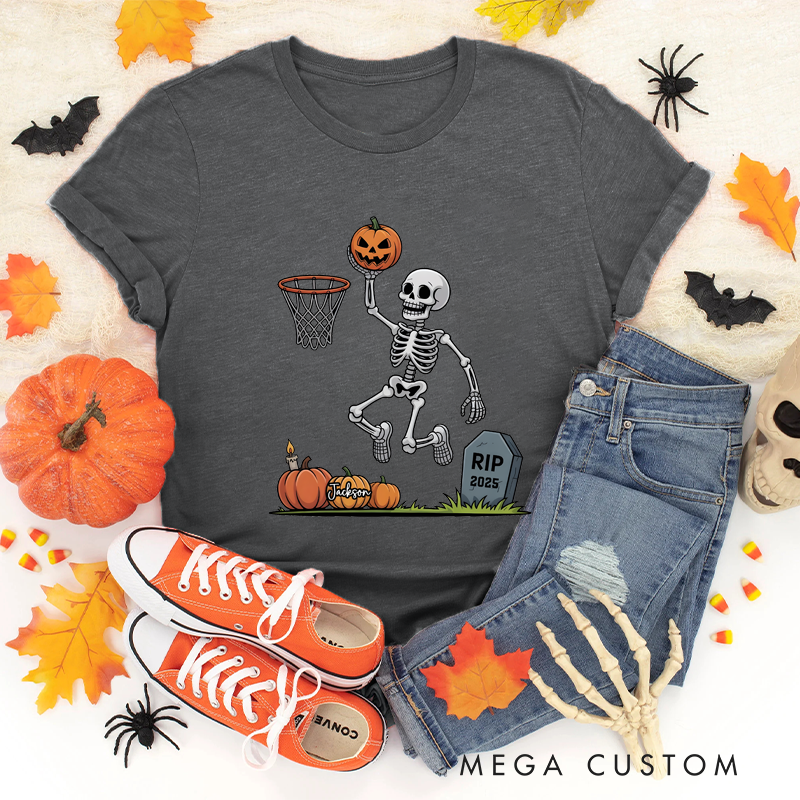 Personalized Halloween Basketball T-Shirt with Skeleton Dunking a Pumpkin Design and Customizable Year